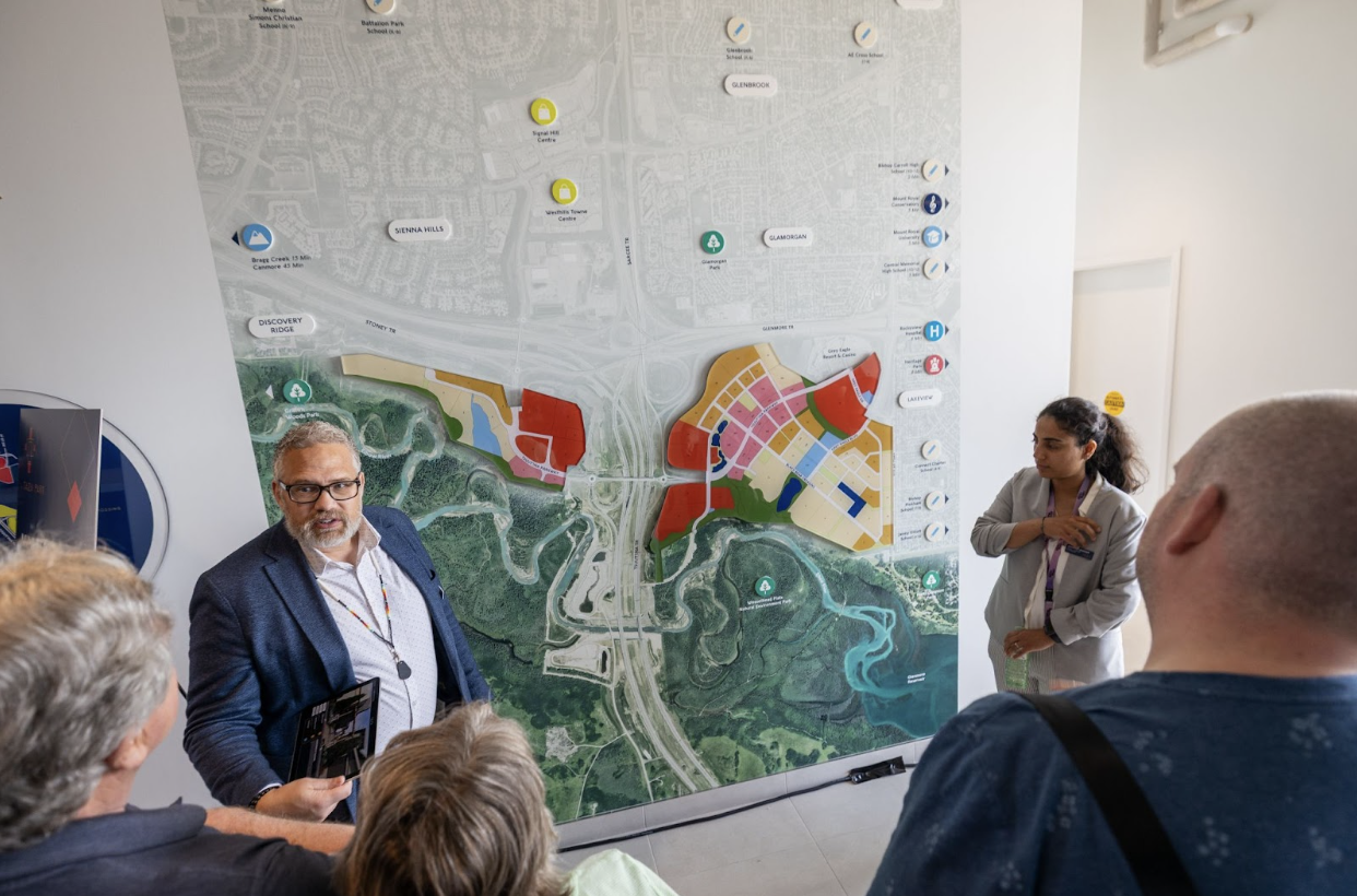 Travis Oberg sharing the vision for Taza Park with visitors at the Sales & Marketing Centre.